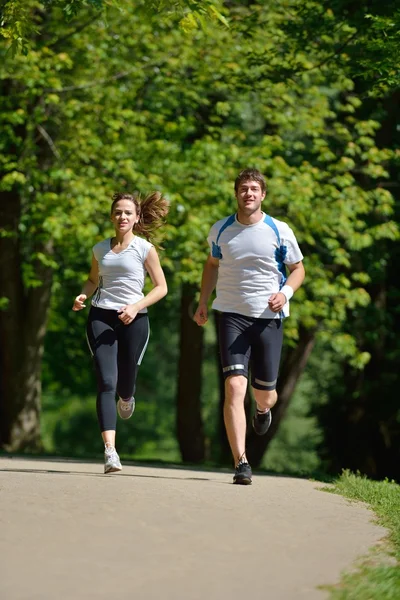 Young couple jogging at morning — Stock Photo, Image