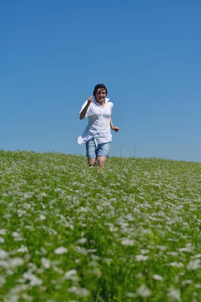 Young happy woman in green field — Stock Photo, Image