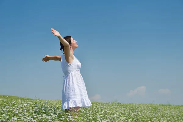 Young happy woman in green field — Stock Photo, Image