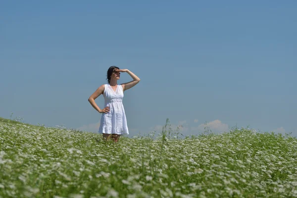 Young happy woman in green field — Stock Photo, Image