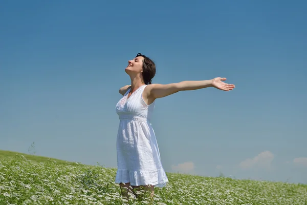 Young happy woman in green field — Stock Photo, Image