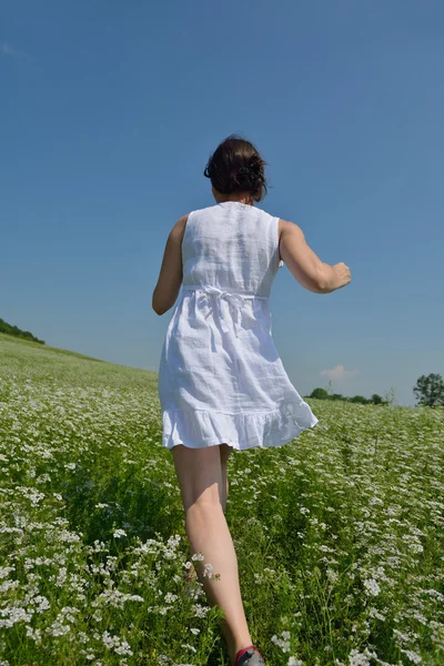 Young happy woman in green field — Stock Photo, Image