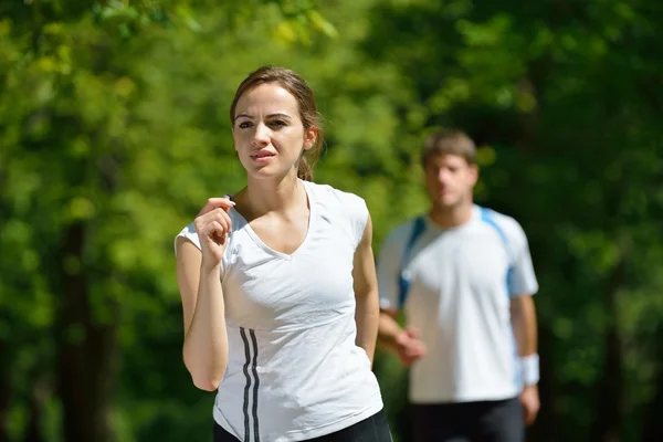 Young couple jogging at morning Stock Image