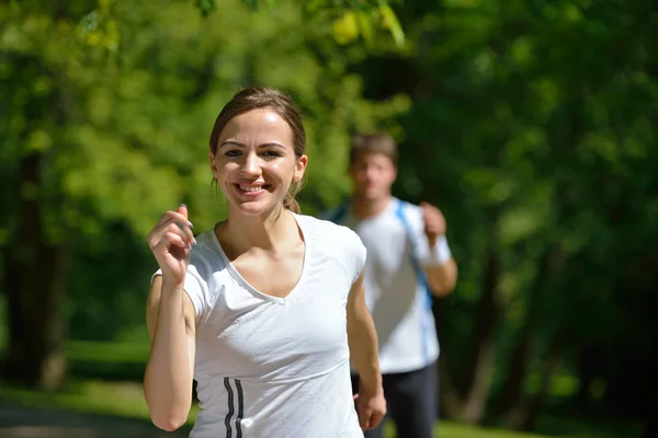 Young couple jogging at morning Stock Photo
