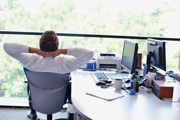 happy young business man at office