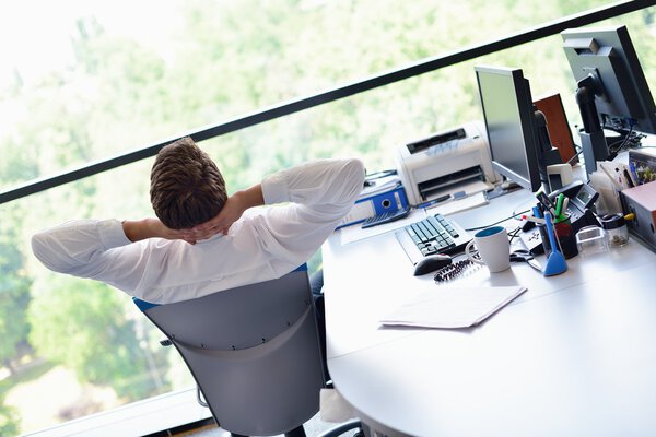happy young business man at office
