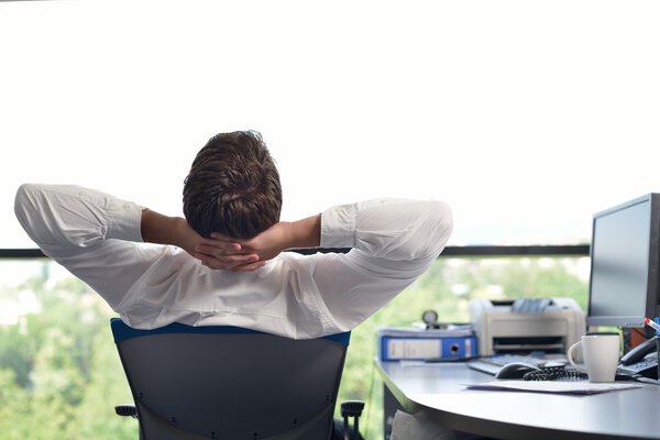 happy young business man at office