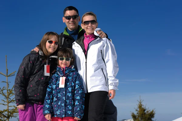 Portrait of happy young family at winter — Stock Photo, Image