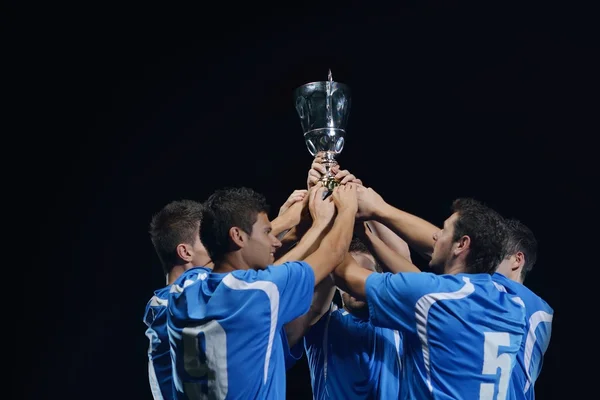 Jogadores de futebol comemorando vitória — Fotografia de Stock