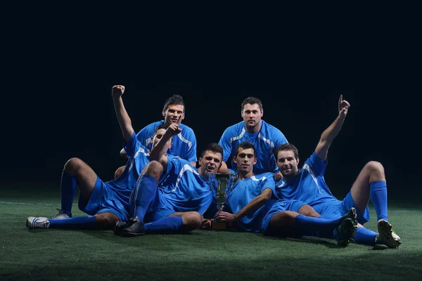 Jogadores de futebol comemorando vitória — Fotografia de Stock