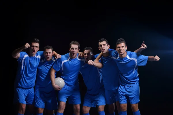 Jogadores de futebol comemorando vitória — Fotografia de Stock