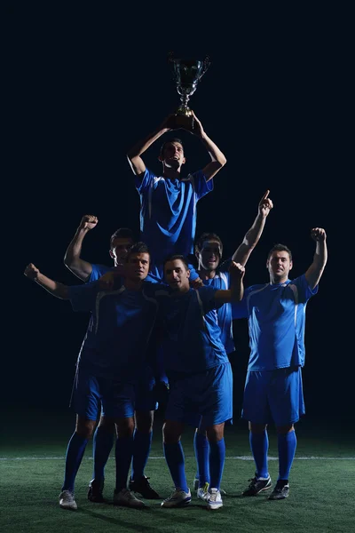 Jogadores de futebol comemorando vitória — Fotografia de Stock