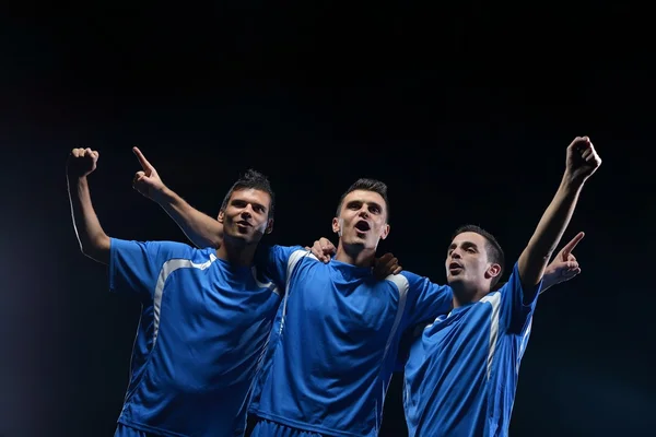 Jugadores de fútbol celebrando la victoria — Foto de Stock