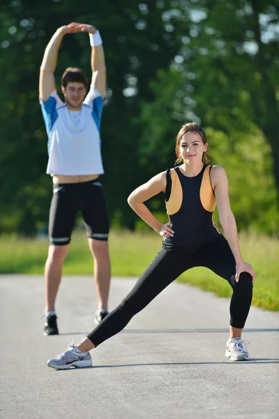 Doing stretching exercise after jogging — Stock Photo, Image