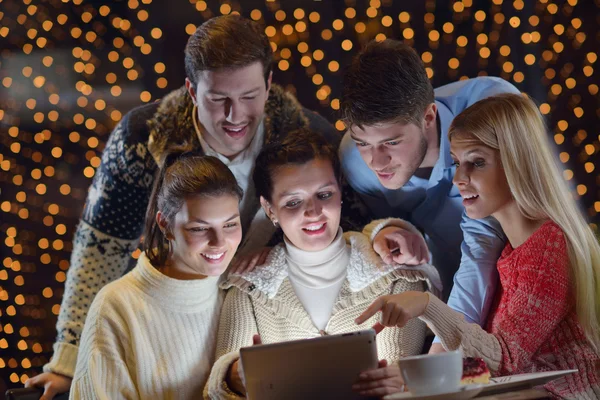 Happy looking at a tablet computer — Stock Photo, Image