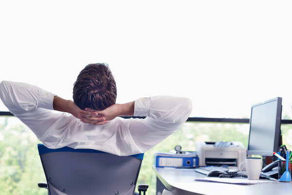 happy young business man at office