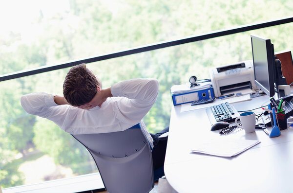 happy young business man at office