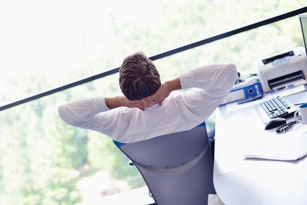 happy young business man at office