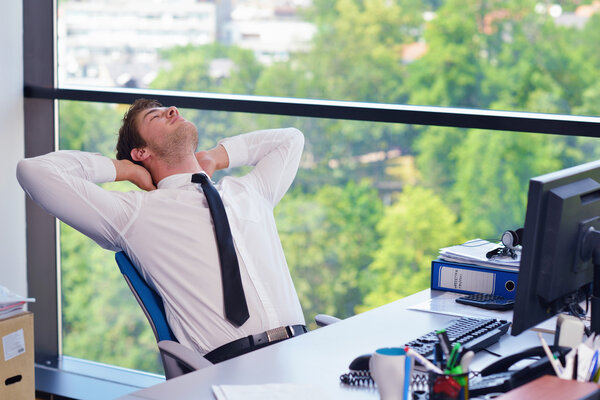 happy young business man at office