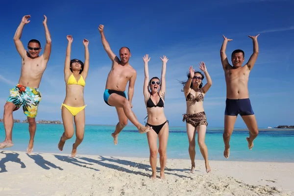 Group of happy young have fun on bach — Stock Photo, Image