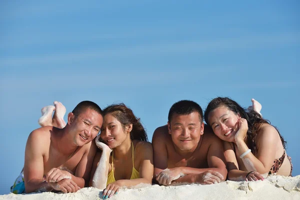 Group of happy young have fun on bach — Stock Photo, Image