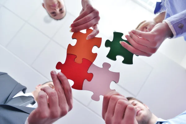 Group of business assembling jigsaw puzzle — Stock Photo, Image
