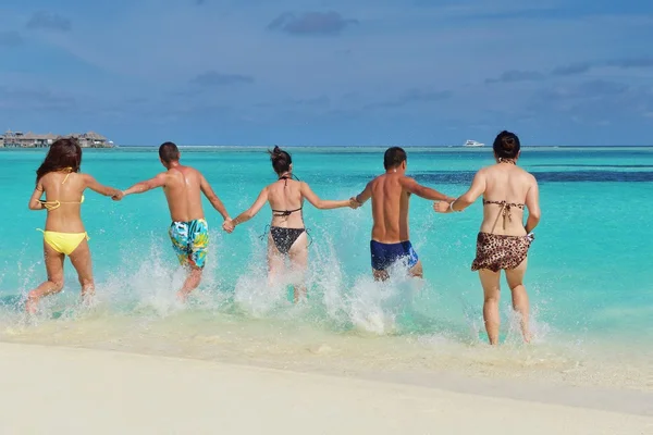 Group of happy young have fun on bach — Stock Photo, Image