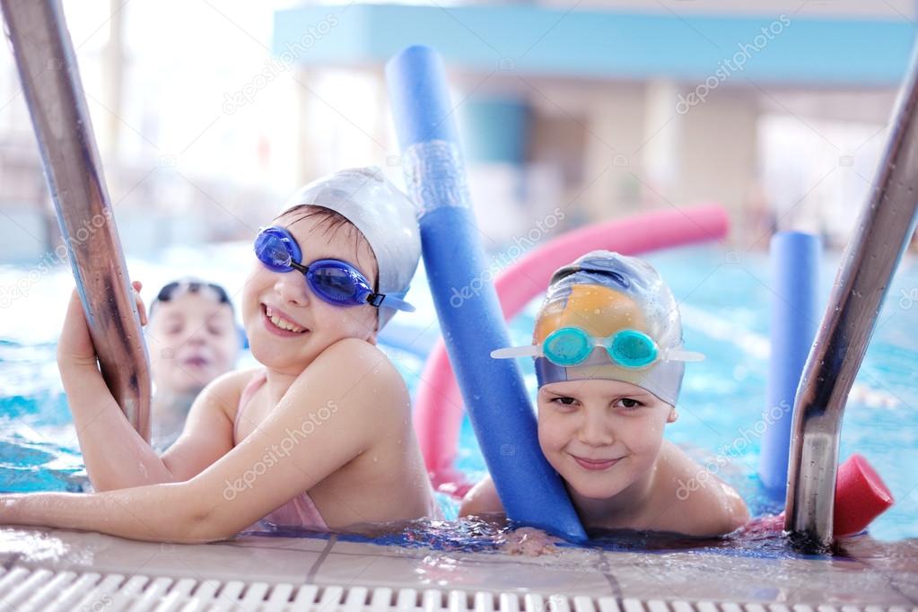 happy children group at swimming pool
