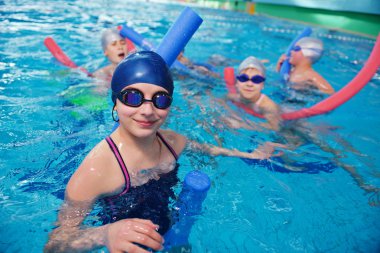 happy children group at swimming pool clipart