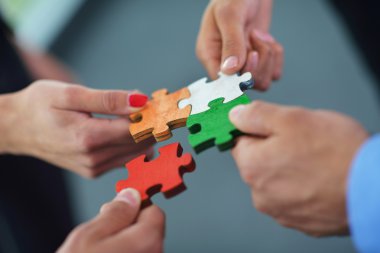Group of business assembling jigsaw puzzle clipart