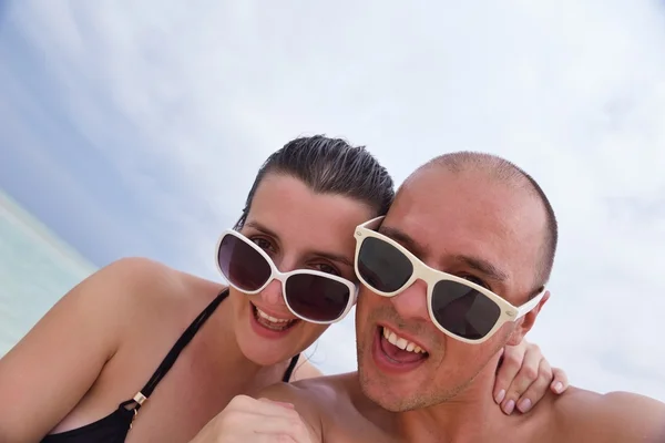 Happy young couple at summer vacation have fun and relax at bea Stock Photo