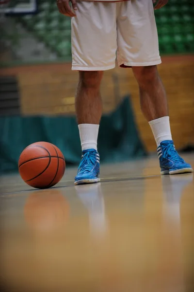 Basketball ball and net on black background — Stock Photo, Image