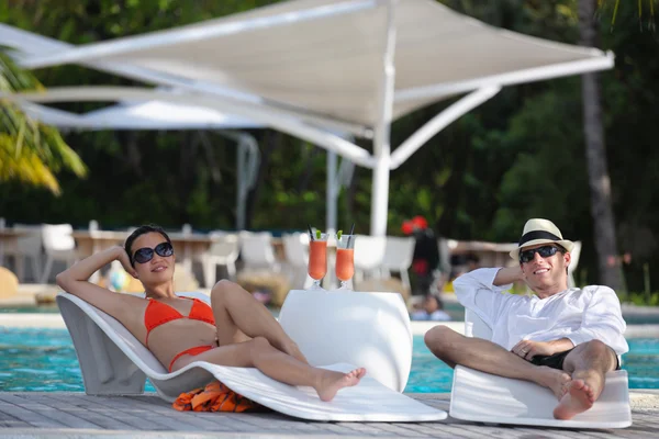 Happy young couple relax and take fresh drink — Stock Photo, Image