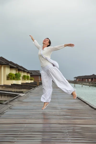 Young woman relax on cloudy summer day — Stock Photo, Image