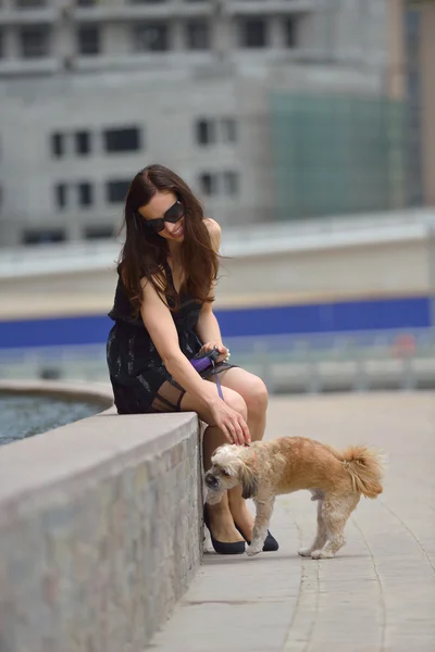 Happy young woman with puppy have fun — Stock Photo, Image