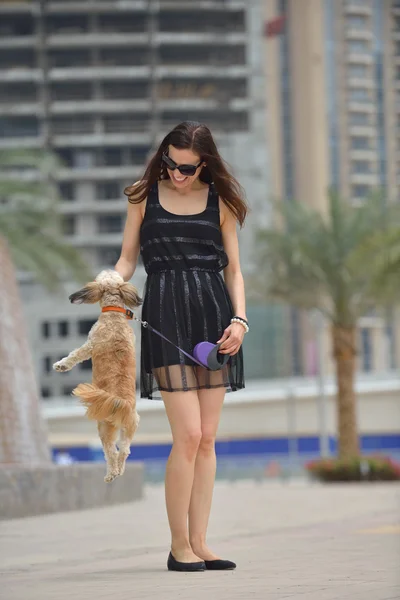 Happy young woman with puppy have fun — Stock Photo, Image