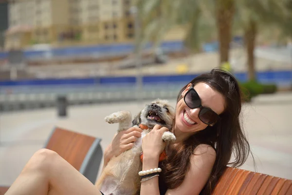 Young woman with puppy have fun — Stock Photo, Image