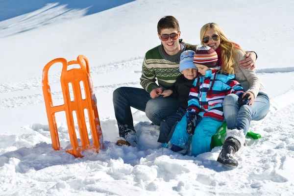 Family having fun on fresh snow at winter vacation — Stock Photo, Image