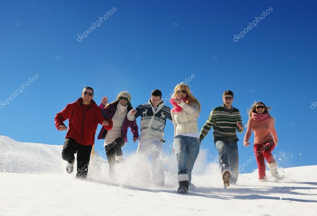 Friends have fun at winter on fresh snow