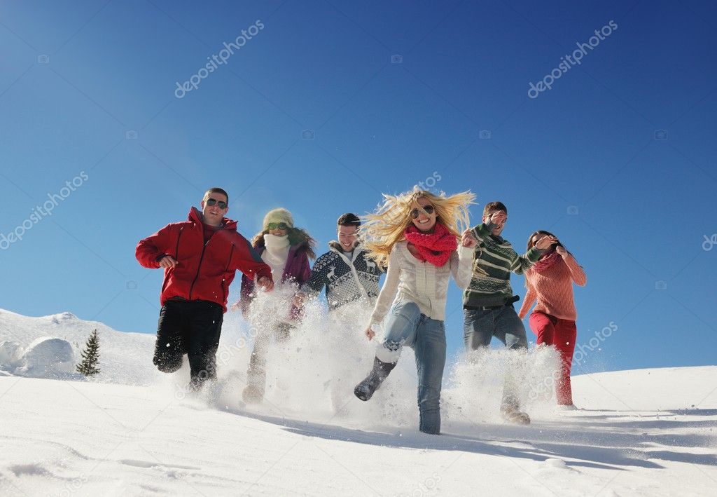 Friends have fun at winter on fresh snow