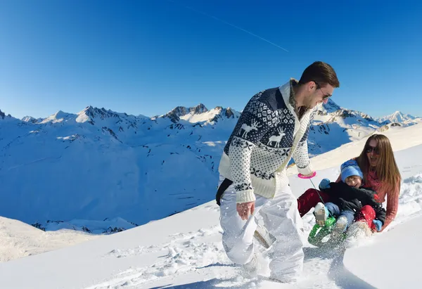 Family riding on sledge — Stock Photo, Image