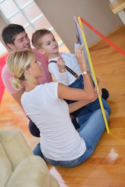 Family drawing on school board at home — Stock fotografie