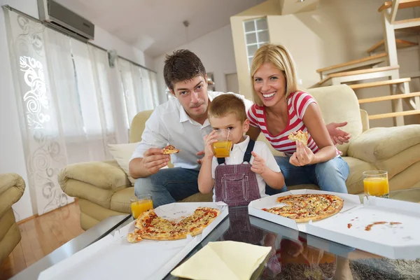 Family eating pizza Stock Image