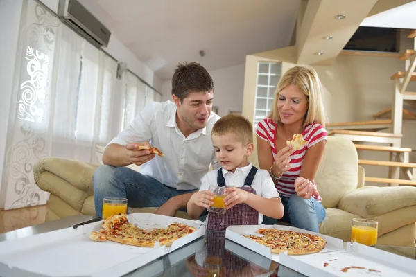 Family eating pizza Stock Photo
