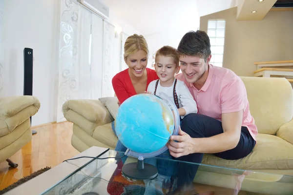 Family have fun with globe — Stock Photo, Image