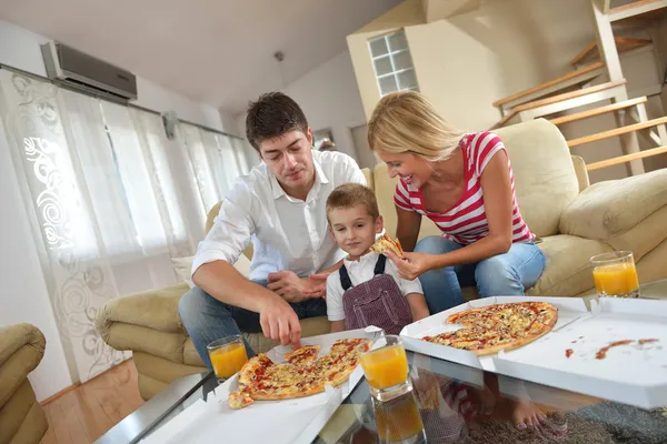 Family eating pizza Stock Picture