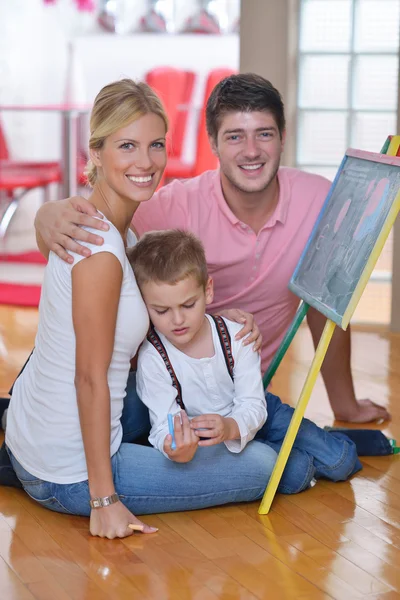 Family drawing on school board at home — Stock Photo, Image