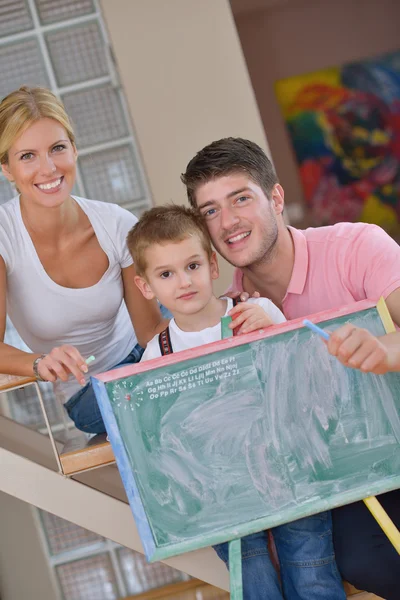 Family drawing on school board at home — Stock fotografie