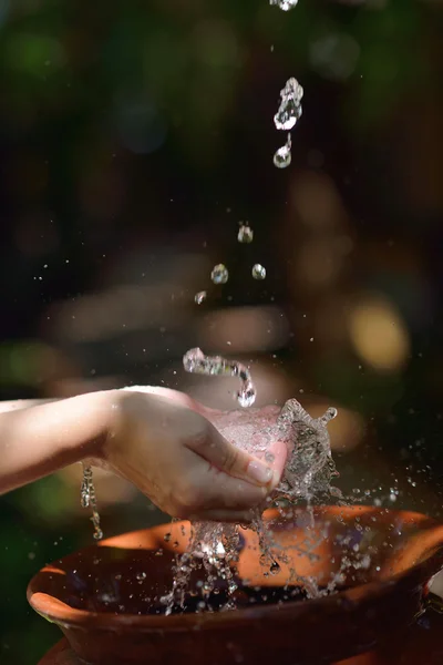 Water on woman hands — Stock Photo, Image