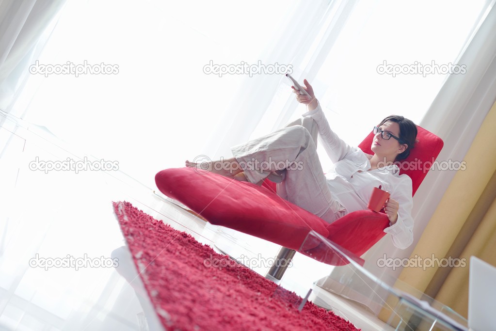 Woman using tv remote